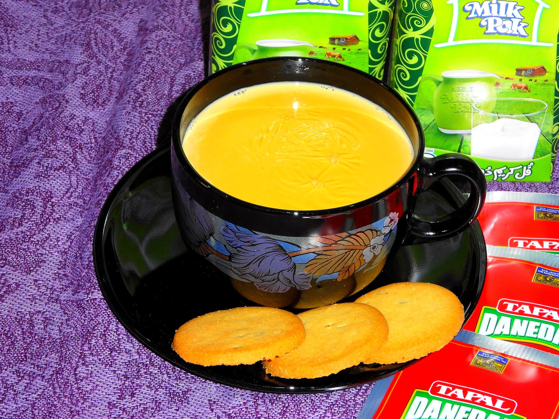 A pot of milk tea with spices, illustrative of doodh patti rather than a named US apartment