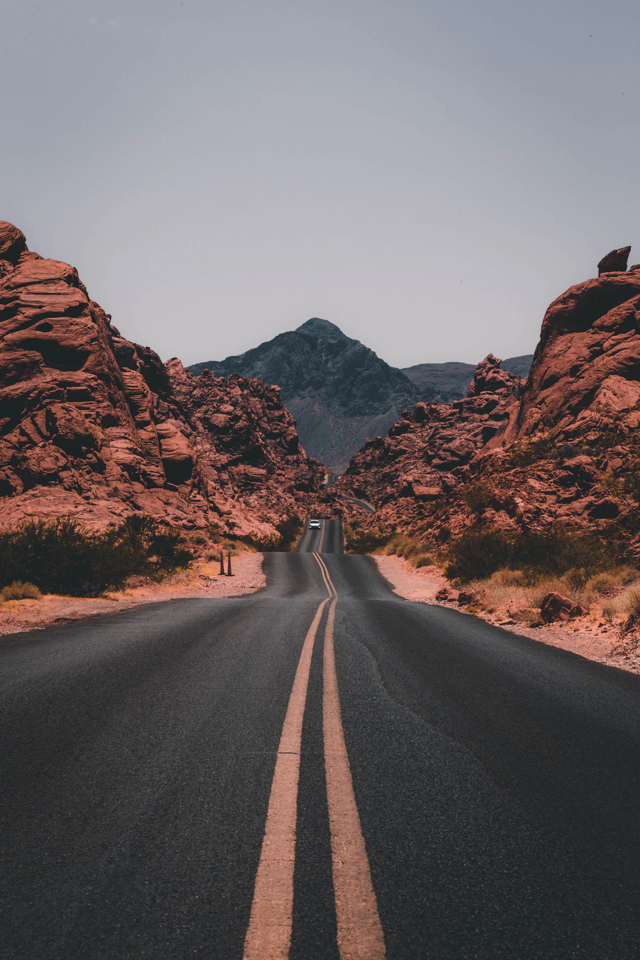 A long open highway crossing a broad landscape