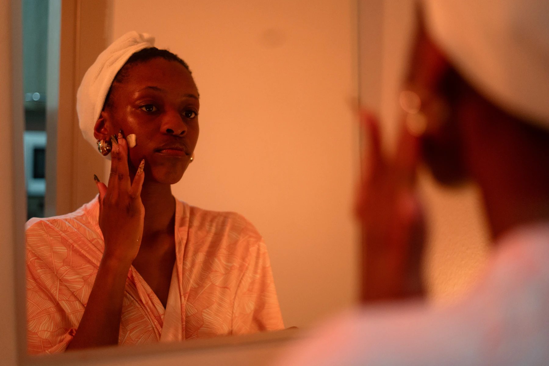 A simple skincare routine in ordinary indoor light rather than campaign lighting.