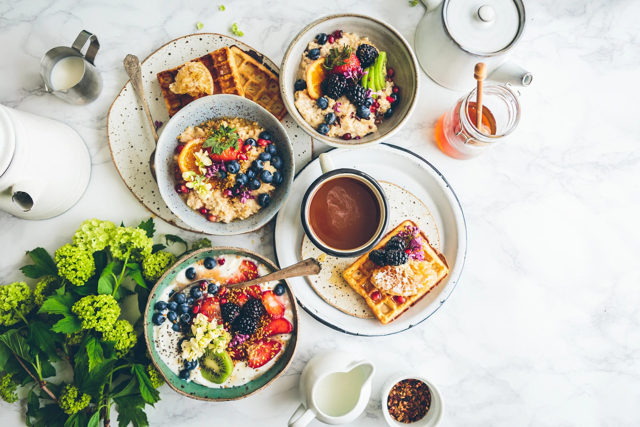 Balanced breakfast with eggs, yoghurt, fruit and wholegrain foods