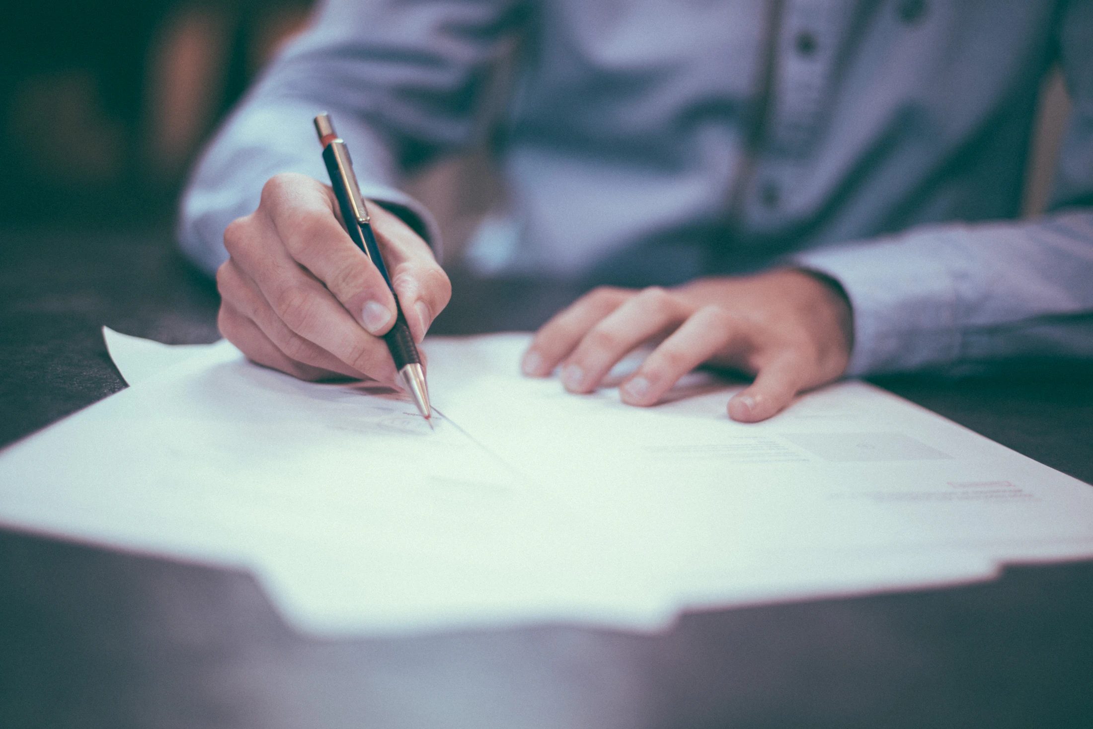 Travel paperwork and financial documents spread across a desk